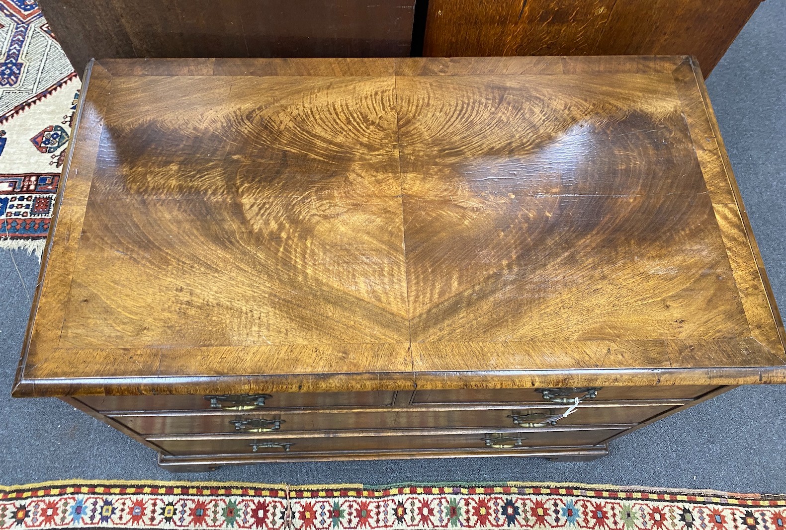 A Queen Anne revival banded walnut chest of two short and two long drawers, width 88cm, depth 46cm, height 74cm